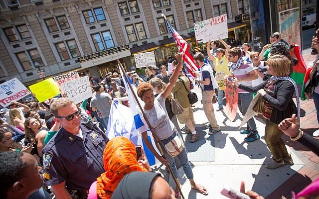 At an anti-Israel protest in Boston on Friday, pro-Palestinian activists surrounded several Israel supporters, hurling insults and allegedly physically assaulting pro-Israel students (photo credit: Elan Kawesch/The Times of Israel)