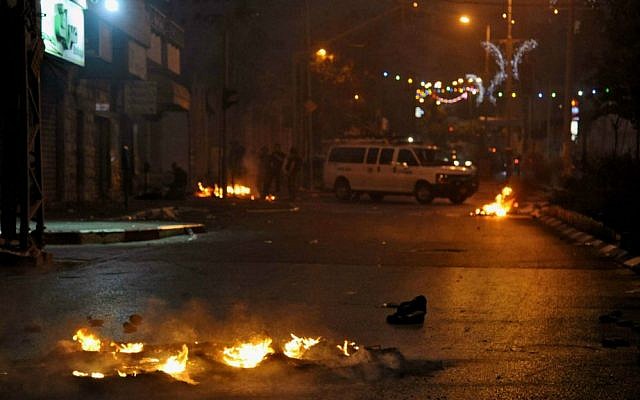 Israeli police secure a street during clashes with Palestinian protesters (unseen) in the Arab Israeli city of Nazareth, northern Israel , July 5, 2014. (photo credit: Gil Eliyahu/Flash90)