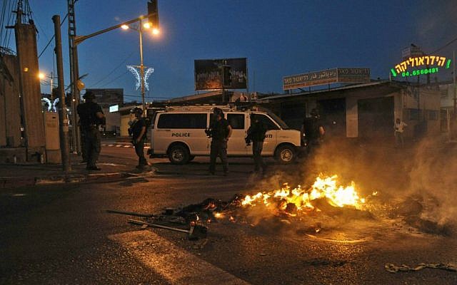 Israeli police secure a street during clashes with Palestinian protesters (unseen) in the Arab Israeli city of Nazareth, northern Israel , July 5, 2014. (photo credit: Gil Eliyahu/Flash90)