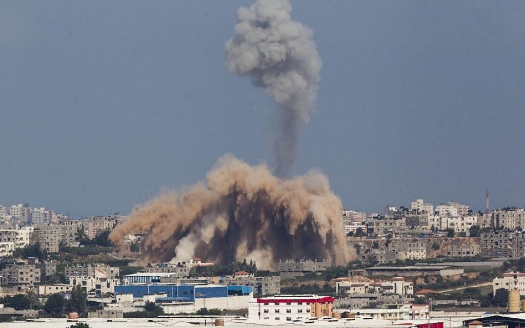 Smoke and debris rise after an Israeli airstrike on the Gaza Strip, as seen from the Israeli side of the Israel-Gaza border on the second day of Operation Protective Edge, Wednesday, July 9, 2014. (photo credit: Yonatan Sindel/Flash90)