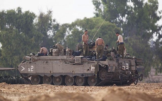 IDF APCs (Armed Personnel Carriers) are seen near the Gaza border in southern Israel on the second day of Operation Protective Edge, Wednesday, July 9, 2014. (photo credit: Yonatan Sindel/Flash90)