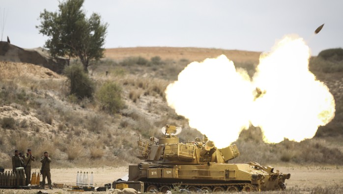IDF Artillery Corps seen firing shells to Gaza, near the border in Southern Israel on July 18, 2014, after Israeli forces began a ground invasion in an escalation of the operation as it entered its 11th day. (Photo credit: Hadas Parush/Flash90)