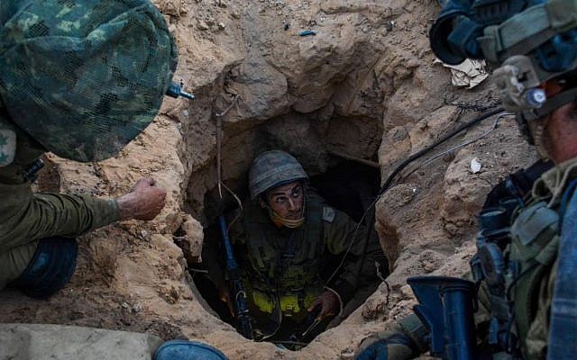 Soldiers from the Givati Brigade seen at the entrance to a Hamas attack tunnel on July 23, 2014, during Operation Protective Edge. (Israel Defense Forces/Flash90)