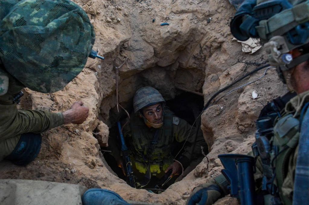 Soldiers from the Givati brigade seen at the entrance to a Hamas 'attack tunnel' on Wednesday, July 23. The brigade's mission is to target Hamas' tunnels that cross under the Israel-Gaza border and enable Hamas terrorists to infiltrate into Israel and carry out attacks. (Photo credit: IDF Spokesperson/FLASH90)