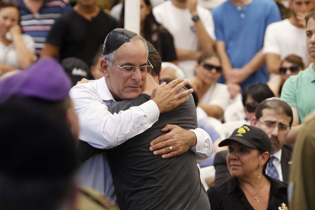Stuart Steinberg and his son, Jake, haltingly recited the mourner's prayer in front of a crowd of thousands (photo credit: Miriam Alster/Flash 90)