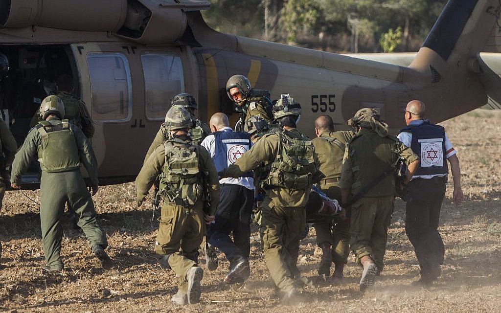 An injured Israeli soldier is evacuated by helicopter from the area close to the Israeli border with the Gaza Strip, July 28, 2014. (photo credit: Yonatan Sindel/Flash90)