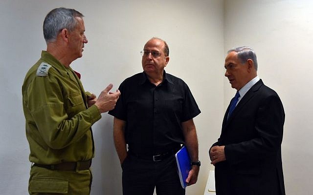 Defense Minister Moshe Ya'alon (center), during the war in Gaza, summer 2014 (photo credit: Ariel Hermoni/Defense Ministry/Flash90)