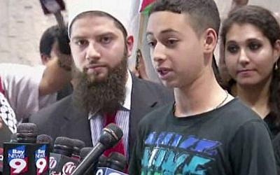 This image from an AP video shows Tariq Abu Khdeir, the Palestinian-American teen who relatives allege was beaten by Israeli authorities earlier this month addressing the media after arriving at at Tampa International Airport on Wednesday night, July 16, 2014, in Tampa, Fla. (AP Photo/AP Video)