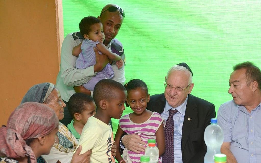 President Reuven Rivlin pays a visit to the family of a wounded soldier, Monday, July 28, 2014. (photo credit: Mark Neiman/GPO)