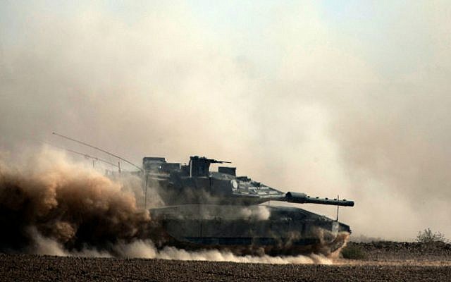 Israeli soldiers seen on Merkava tank near the Gaza border in Southern Israel, on the tenth day of Operation Protective Edge, July 17, 2014. (photo credit: Flash90)