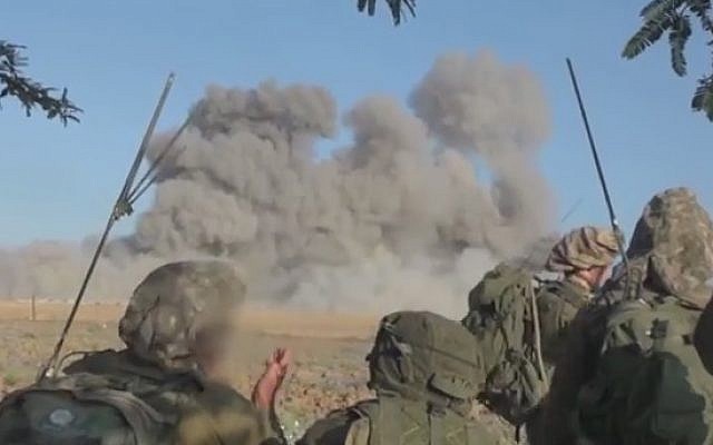 IDF ground troops look on following an Israeli strike in Gaza (Photo credit: Youtube screen capture)