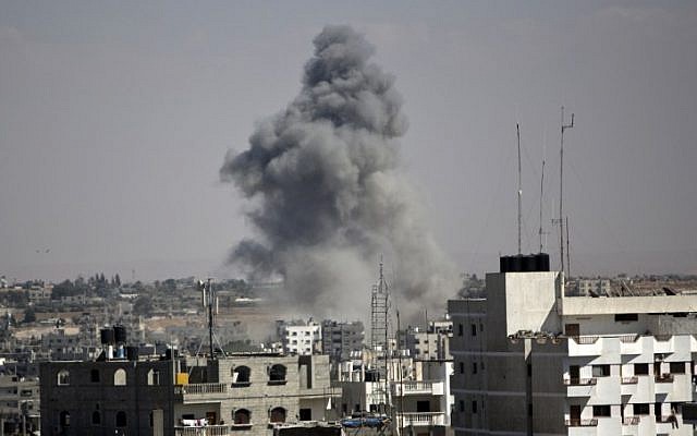 Smoke rises following an Israeli strike on Rafah, in the southern Gaza Strip, on August 3, 2014. (photo credit: AFP/Mahmud Hams)