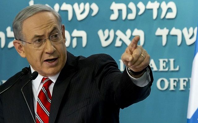Prime Minister Benjamin Netanyahu gestures during a press conference at his Jerusalem offices, on Wednesday, August 6, 2014 (photo credit: AFP/JIM HOLLANDER/POOL)