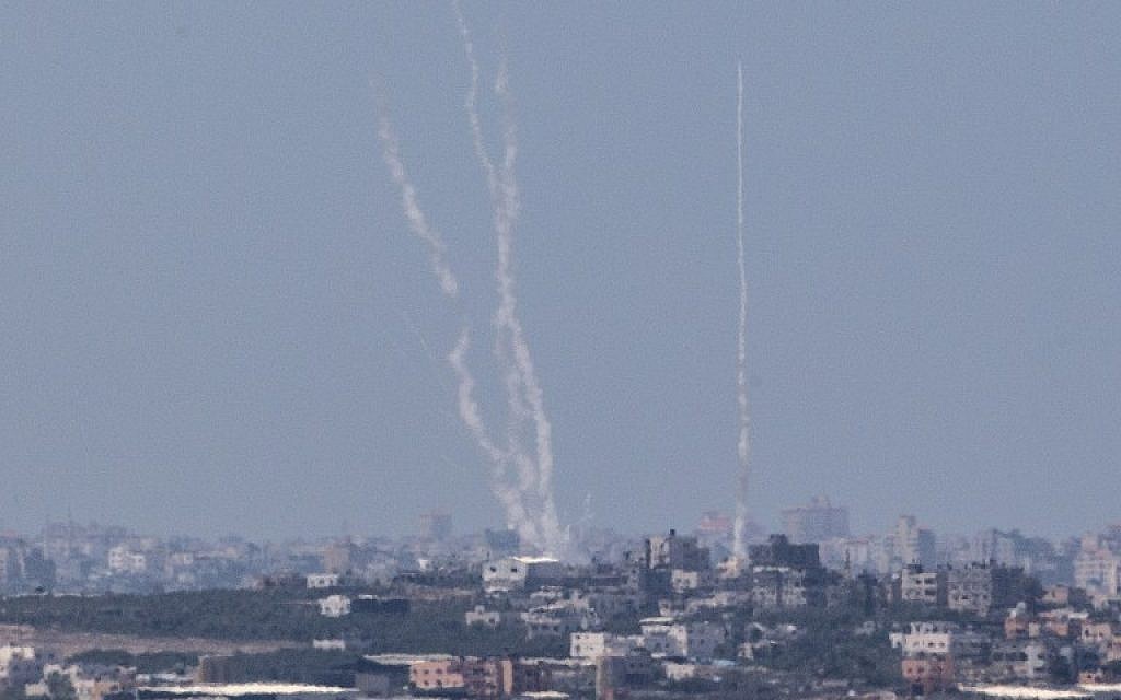 A photo from the Israeli side of the Israel-Gaza border shows a smoke trail of rockets being fired by Palestinian terrorists from the Gaza Strip into Israel, August 22, 2014. (AFP/Jack Guez)
