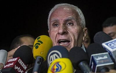 Head of the Palestinian delegation Azzam al-Ahmed gives a press conference at a hotel in Cairo late on August 13, 2014 (Photo credit: Khaled Desouki/AFP)