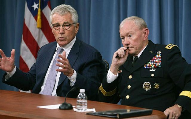 US Secretary of Defense Chuck Hagel (L) and Chairman of the Joint Chiefs of Staff General Martin Dempsey speak to the media during a press briefing at the Pentagon August 21, 2014 in Arlington, Virginia. (photo credit: Mark Wilson/Getty Images/AFP)