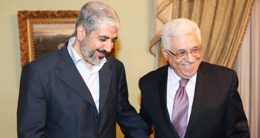 Khaled Mashaal, political leader of Hamas (left), meets with Palestinian Authority President Mahmoud Abbas in Cairo, Egypt, December 21, 2011. (photo credit: AP)