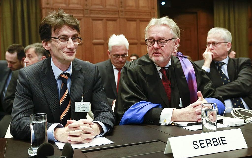 William Schabas, right, and members of a Serbian delegation at the International Court of Justice in The Hague, Netherlands in March. Schabas heads a UN Human Rights Commission inquiry into war crimes during the 2014 Gaza conflict (photo credit: AP/Jiri Buller)