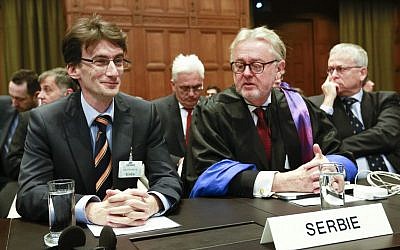 William Schabas, right, and members of a Serbian delegation at the International Court of Justice in The Hague, Netherlands in March. Schabas was named August 11 to head a UNHCR commission to look into war crimes during the Gaza conflict (photo credit: AP/Jiri Buller)