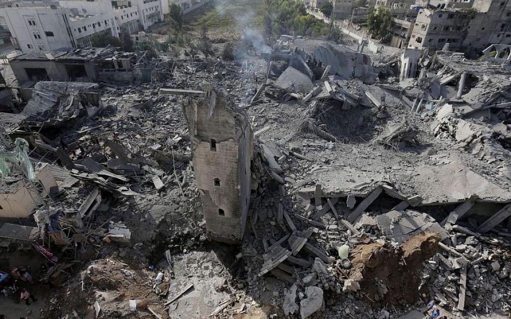 Smoke billows from the rubble of the Imam Al Shafaey mosque, destroyed in an overnight Israeli strike in Gaza City in the northern Gaza Strip on Saturday, Aug. 2, 2014. Israel said it hit five mosques in which rockets were hidden. (Photo credit: AP/Lefteris Pitarakis)