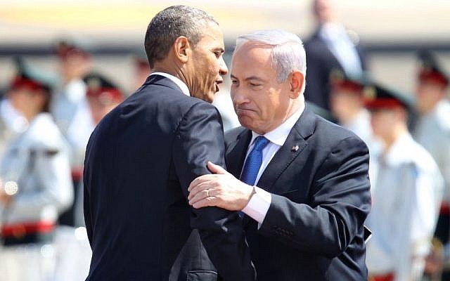 Prime Minister Benjamin Netanyahu, right, and President Barack Obama embrace at a ceremony welcoming the US leader at Ben Gurion Airport near Tel Aviv, on March 20, 2013 (photo credit: Miriam Alster/Flash90)