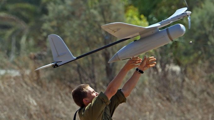 An Israeli soldier seen launching a drone, an unmanned aerial vehicle equipped with cameras that produces video images of the battlefield and provides full, aerial real-time intelligence images to forces in the field, on the seventh day of Operation Protective Edge, on July 14, 2014. (Yossi Aloni/Flash90)