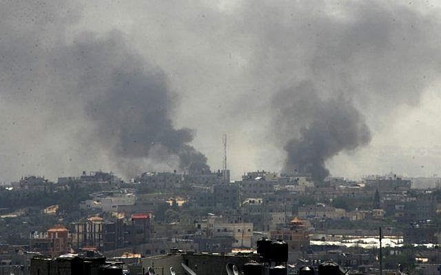 Smoke rises following what witnesses said were Israeli air strikes in Rafah, in the southern Gaza Strip, Friday, August 1, 2014. (photo credit: Abed Rahim Khatib/Flash90)