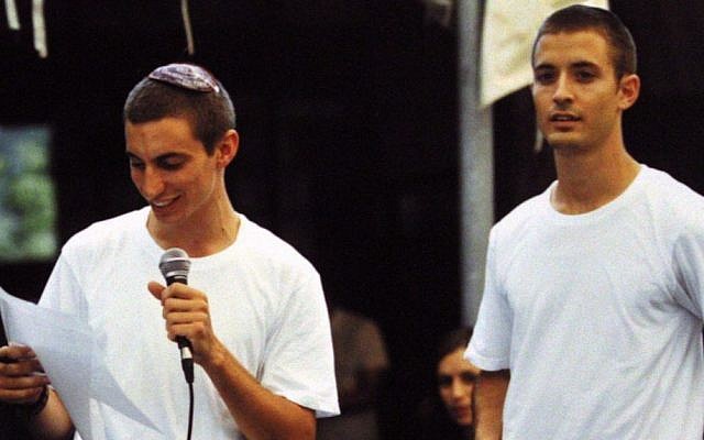 Hadar Goldin (left), and his twin brother Tzur. The IDF spokesman early August 3 announced the death of of IDF officer Lt. Hadar Goldin, who fell in battle in the Gaza Strip on August 1. (Flash90)