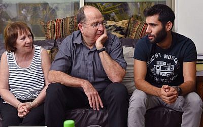 Defense Minister Moshe Ya'alon visits the family of IDF Golani Brigade soldier St.-Sgt. Oron Shaul in the northern village of Poria on August 10, 2014 (Photo credit: Ariel Hermoni/Ministry of Defense/Flash90)
