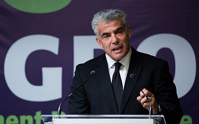Finance Minister Yair Lapid speaks to reporters at the Government Press Office in Jerusalem on Sunday, August 31, 2014. (photo credit: Yonatan Sindel/Flash90)