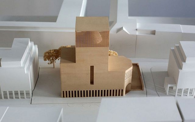 In this Friday, July 4, 2014 photo, a model of the prayer and educational building House of One is displayed at the office of the House of One association in Berlin. The House of One will house a Jewish synagogue, a Christian church and a mosque. (AP Photo/Markus Schreiber)