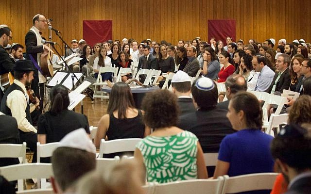 Riverway Project members gather at Boston's Temple Israel for High Holidays services led by Rabbi Matthew Soffer. (Courtesy Riverway Project/JTA)