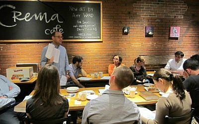 Rabbi Matthew Soffer, director of the Riverway Project, leads a Torah discussion at a Riverway Cafe gathering in Cambridge, Mass., May 2014. (Courtesy Riverway Project/JTA)