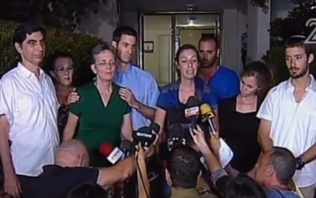 The family of Givati Brigade officer Hadar Goldin speaks to the press, August 2, shortly before they were told of his death (screen capture: Channel 2)