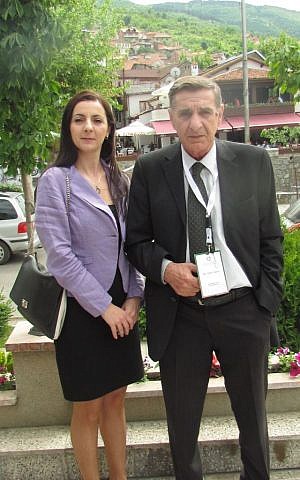 The Kosovo Jewish community's president, Votim Demiri with his daughter Ines, a foreign ministry official, in Prizren. (Ron Kampeas/JTA)