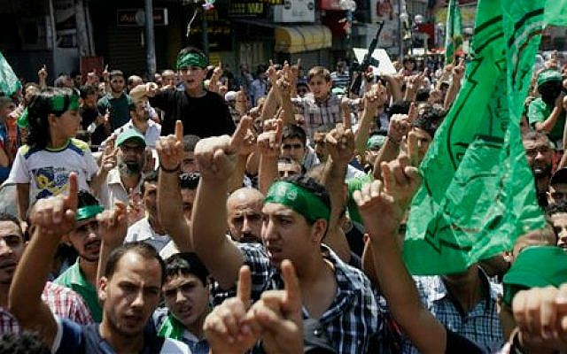 Hamas supporters at a demonstration in the West Bank city of Nablus on Friday, Aug. 15, 2014 (photo credit: AP Photo/Nasser Ishtayeh)