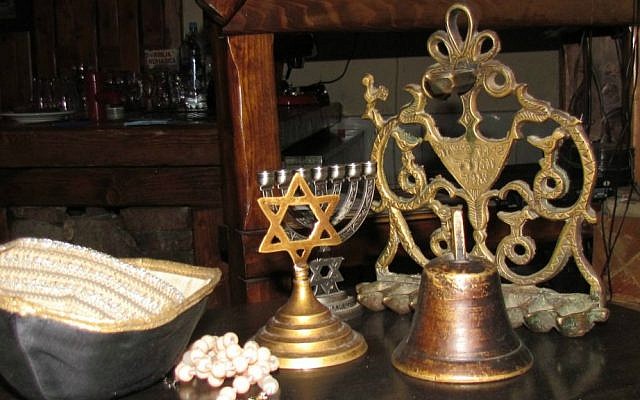 Jewish ritual objects kept by Ilir Zhubi, whose grandfather was Jewish, in his Pristina restaurant. (Ron Kampeas/JTA)