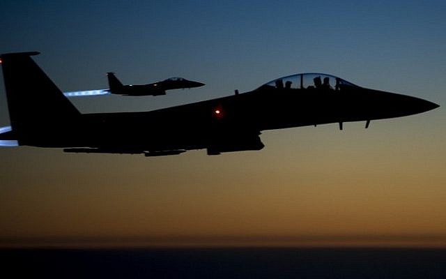 A pair of US Air Force F-15E Strike Eagles flying over northern Iraq early in the morning of September 23, 2014 after conducting airstrikes in Syria (Photo credit: AFP / US Air Forces Central Command via DVIDS / Senior Airman Matthew Bruch)