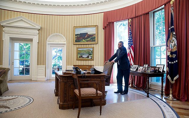 US President Barack Obama talks on the phone in the Oval Office, July 25, 2014. (photo credit: Pete Souza/ White House)