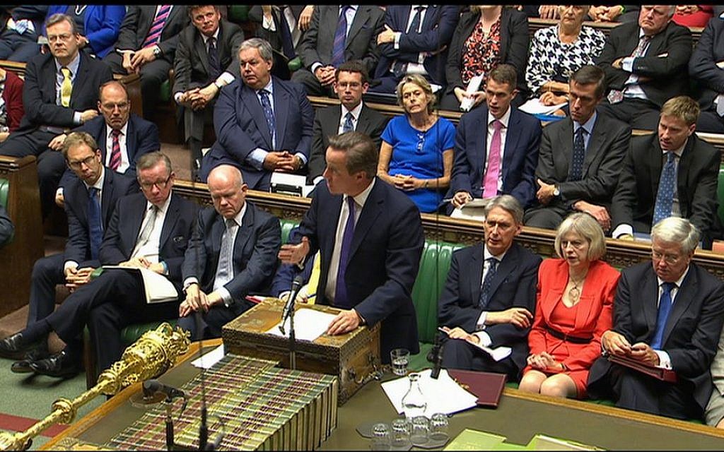 British Prime Minister David Cameron (front, center) speaks during a debate in the Houses of Parliament, Friday, September 26, 2014 (photo credit: AP/Parliamentary Recording Unit)