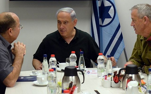 Prime Minister Benjamin Netanyahu (C ), Defense Minister Moshe Ya'alon (R ), and IDF Chief of Staff Benny Gantz (L) visit the Hatzor Israeli Air Force base on August 27, 2014. (photo credit: Haim Zach/GPO/Flash90)