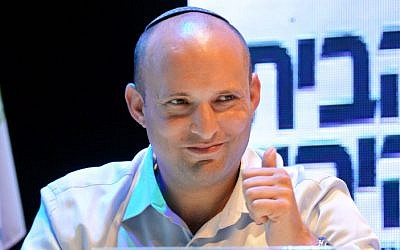 Head of the Jewish Home party, Naftali Bennett, smiles during a party conference on September 10 (photo credit: Flash90)