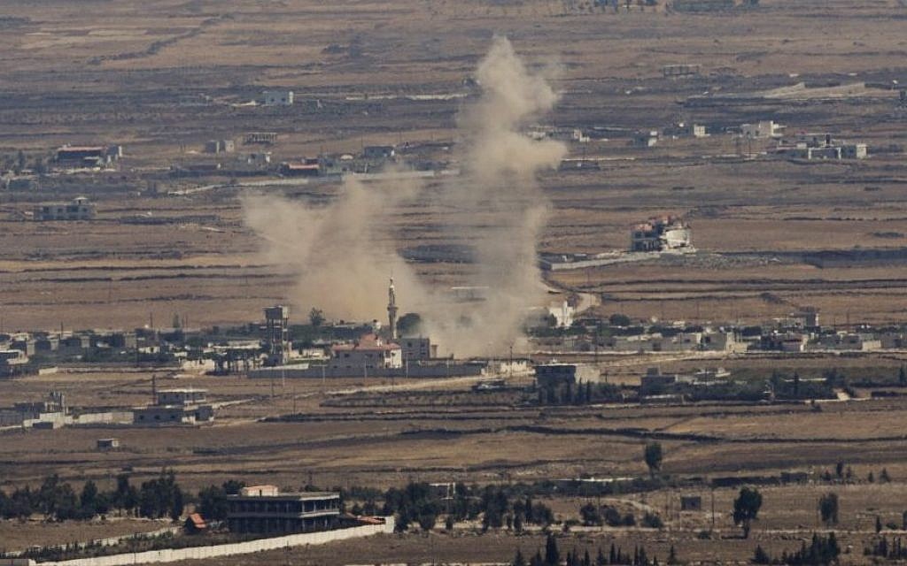 Illustrative: Smoke rises following an explosion in Syria's Quneitra province as Syrian rebels clash with Assad regime forces, seen from the Golan Heights in 2014. (AP/Ariel Schalit, File)