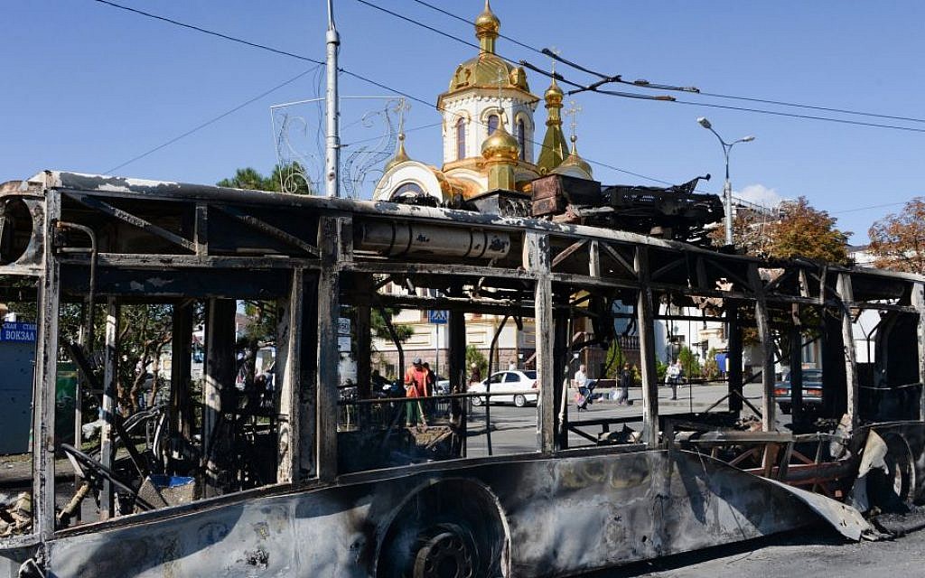 Illustrative image of a burned trolleybus near Donetsk train station after shelling, Donetsk, Ukraine, Saturday, Aug. 30, 2014. (AP Photo/Mstyslav Chernov)