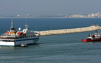 File: The Mavi Marmara is towed by a tugboat as it leaves the port of the northern city of Haifa, August 5, 2010. (Herzl Shapira/Flash90)
