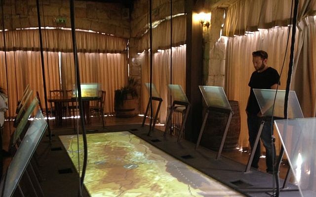 An oversized map of greater Israel serves as one of the activities in the Psagot visitor's center, where wine tasting isn't necessarily on the menu (photo credit: Jessica Steinberg/Times of Israel)