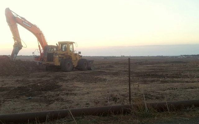 A tractor on Tuesday morning at the first site where Afek hopes to begin drilling. A temporary injunction stopped work at the site on Monday night  (Courtesy photo: Adam Teva VDin)