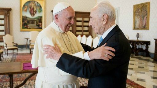 Pope Francis embraces former Israeli president Shimon Peres on September 4, 2014 prior to a private audience at the Vatican. (photo credit: AFP/Osservatore Romano)