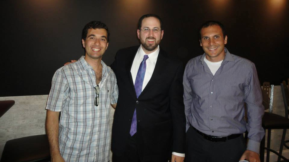Rabbi Yitzchok Fingerer (middle) with two members of the Brooklyn Jewish Experience. (Courtesy: Brooklyn Jewish Experience)