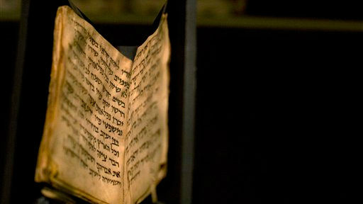 An ancient prayer book is seen on display at the Bible Lands museum in Jerusalem, Thursday, Sept. 18, 2014 (photo credit: AP/Sebastian Scheiner) 